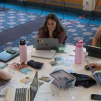 roundtable of persons working collaboratively indoors